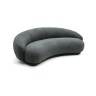 Julep Sofa with rounded backrest, sculptural curves, and soft fabric upholstery in modern minimalist style.