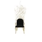 Abstract brass chair with twig-inspired frame and fine fabric upholstered seat