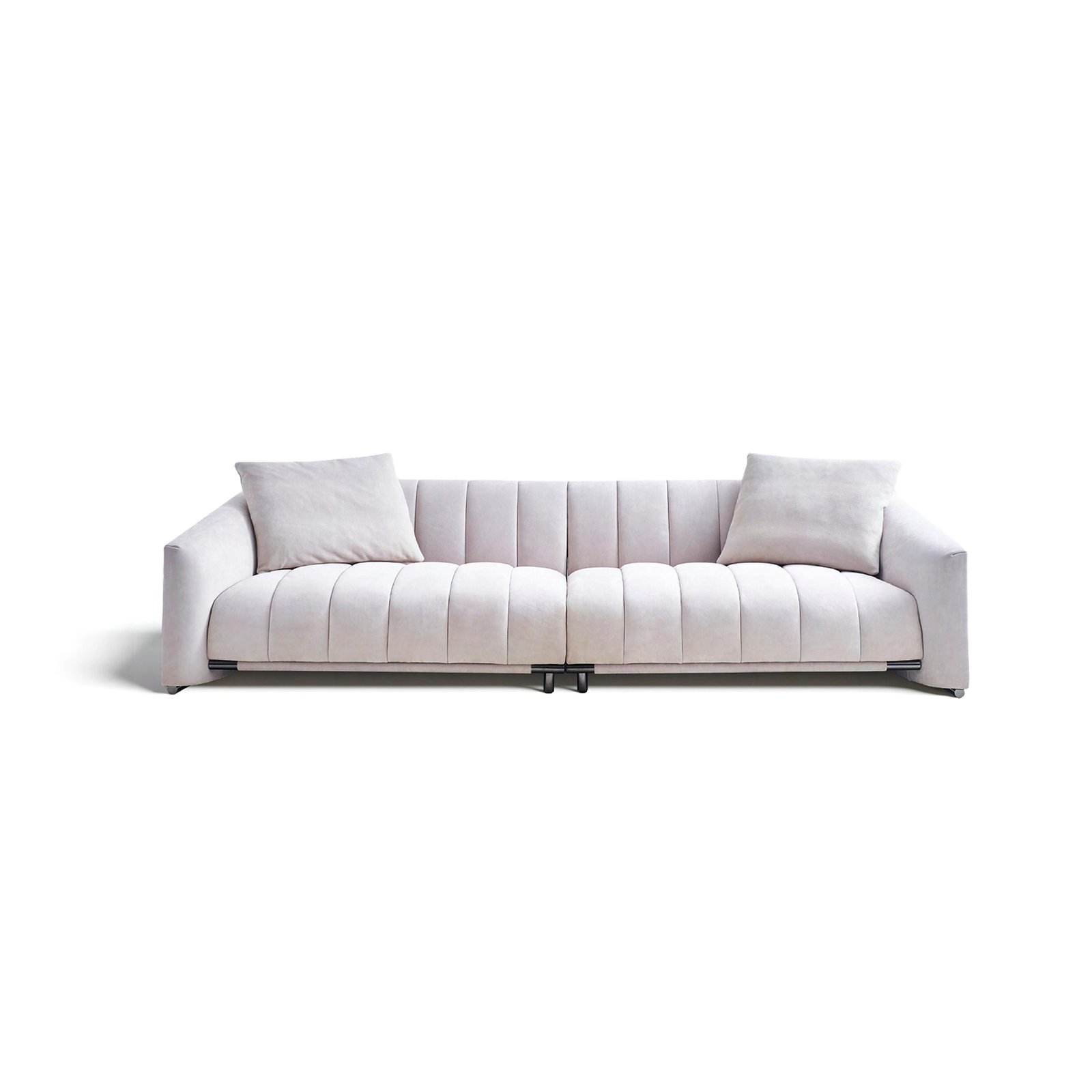 Beige frosted leather sofa with piano-key inspired cushions and stainless steel legs