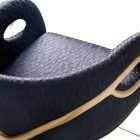 Closer view of Chandra Bar Stool with polished brass frame and curved upholstered seat