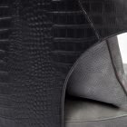 detail show of crocodile embossed leather on a luxury dining chair