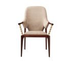 Luxury beige nubuck leather dining chair with brass hourglass arm supports front view
