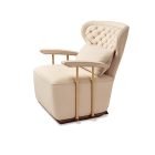 Leather lounge chair with beige nubuck leather and brass sculpture supports