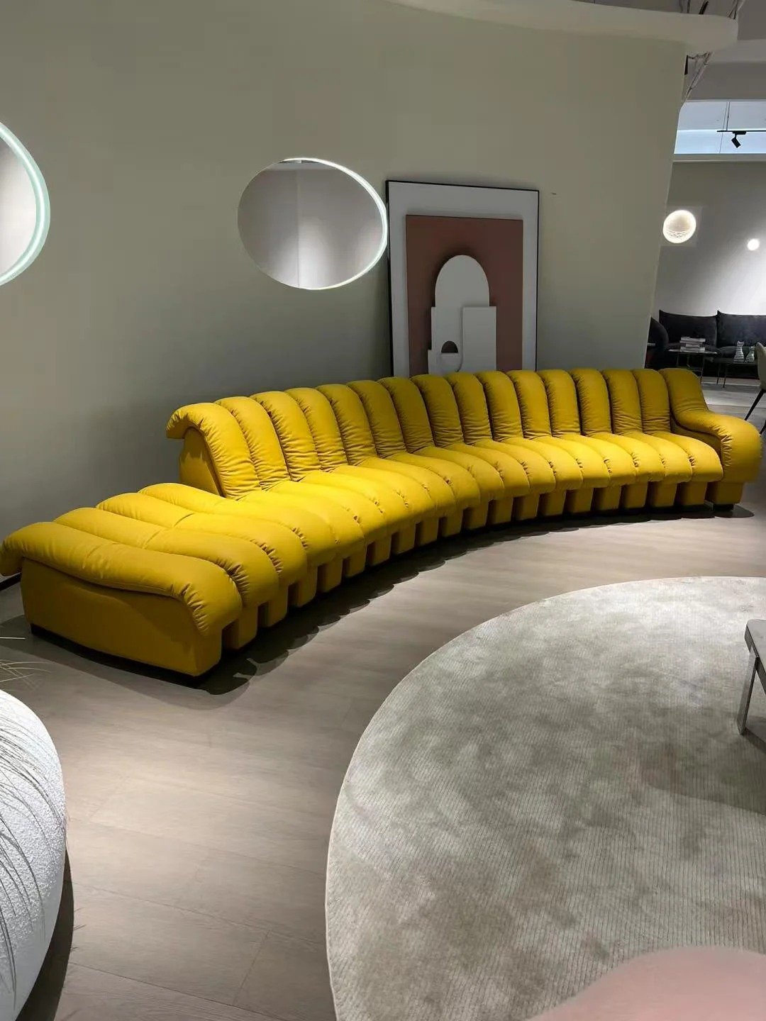 Snake Sofa modular yellow leather design with sculptural connected seating units.